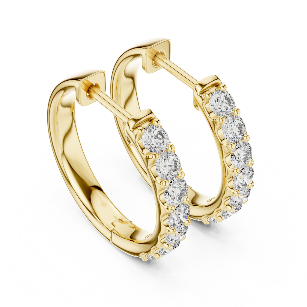 Roy Diamond yellow gold huggie hoop earrings close front angle with sparkling round diamonds on the outer edge