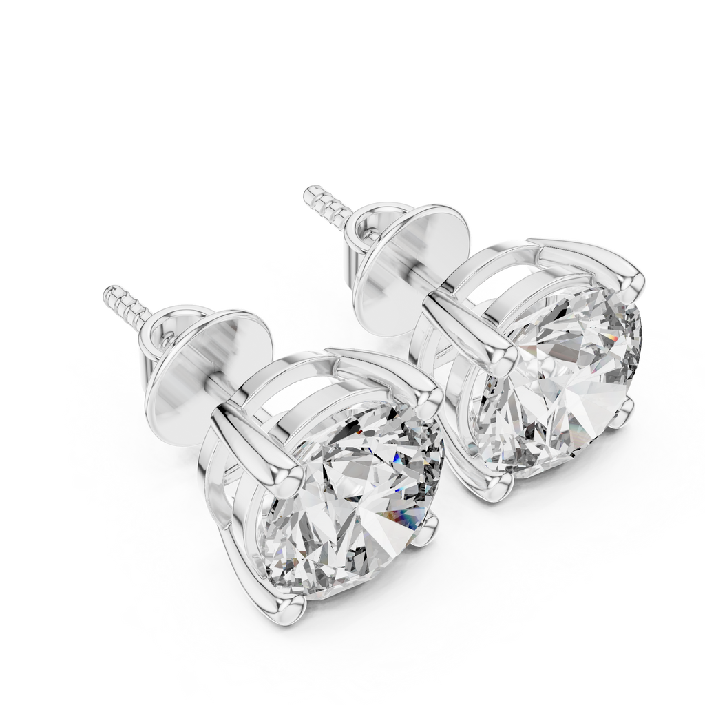 Pair of diamond stud earrings on a white background