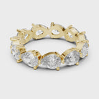 360 rotating video of Roy Diamond yellow gold pear shape eternity band ring showing full sparkle and prong details