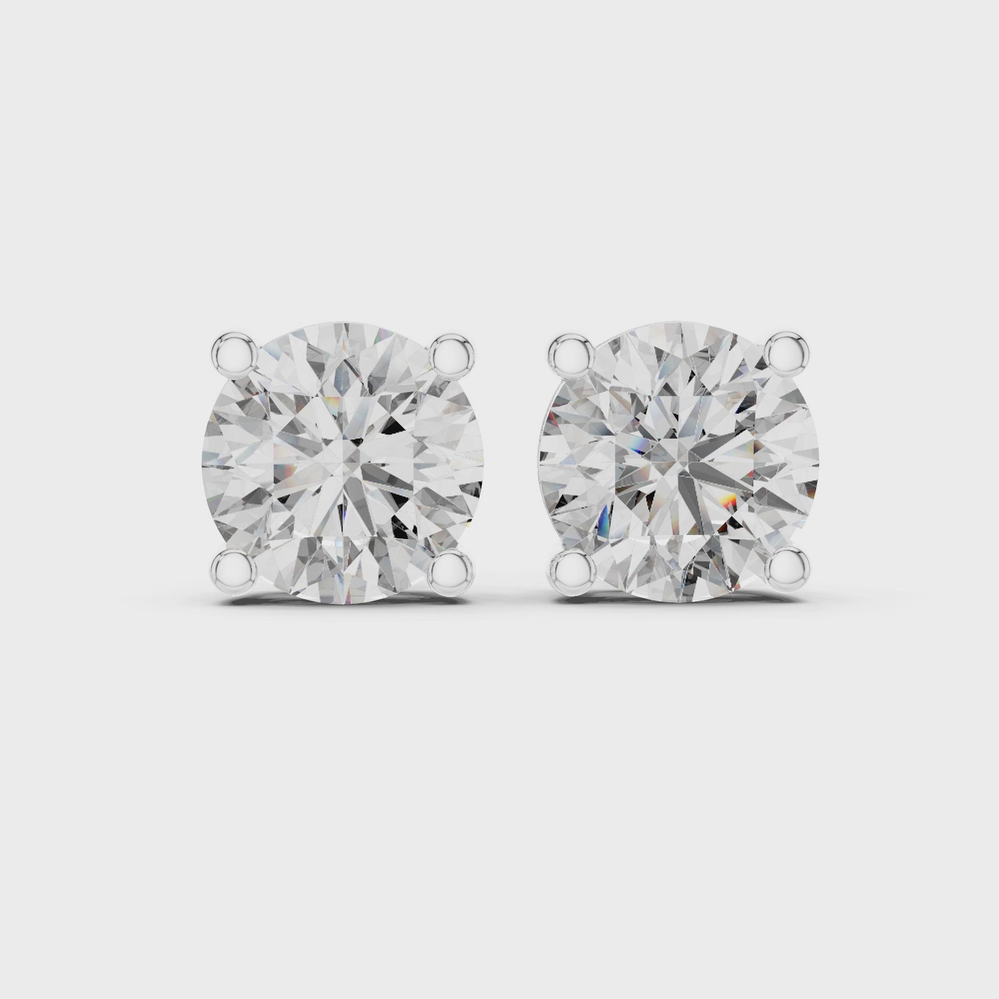 White gold Roy Diamond round solitaire stud earrings 360 video showcasing sparkle and prong setting 4.00 CT TW
