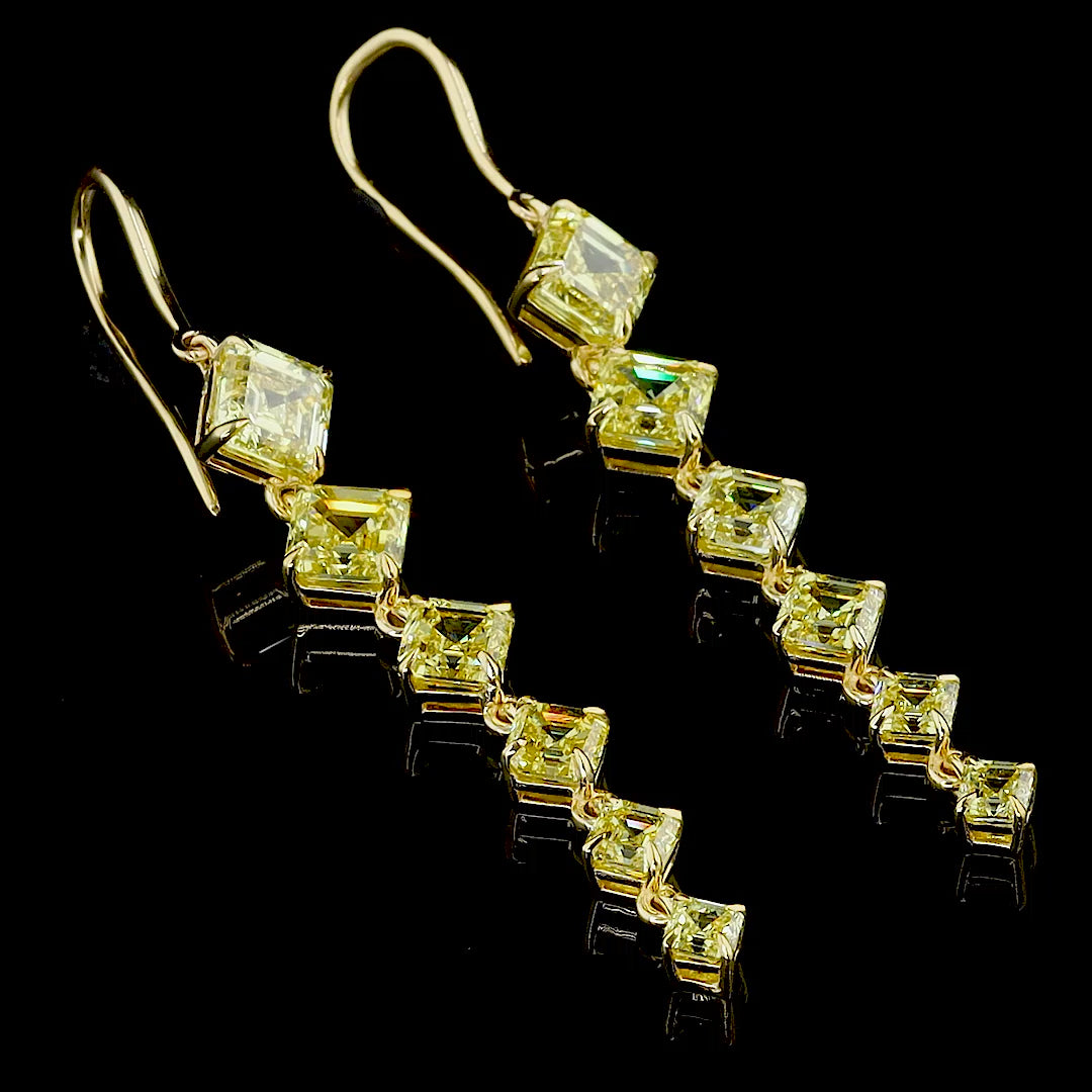 360° product video showing 8.51 CT fancy vivid yellow square emerald diamond earrings by Roy Diamond