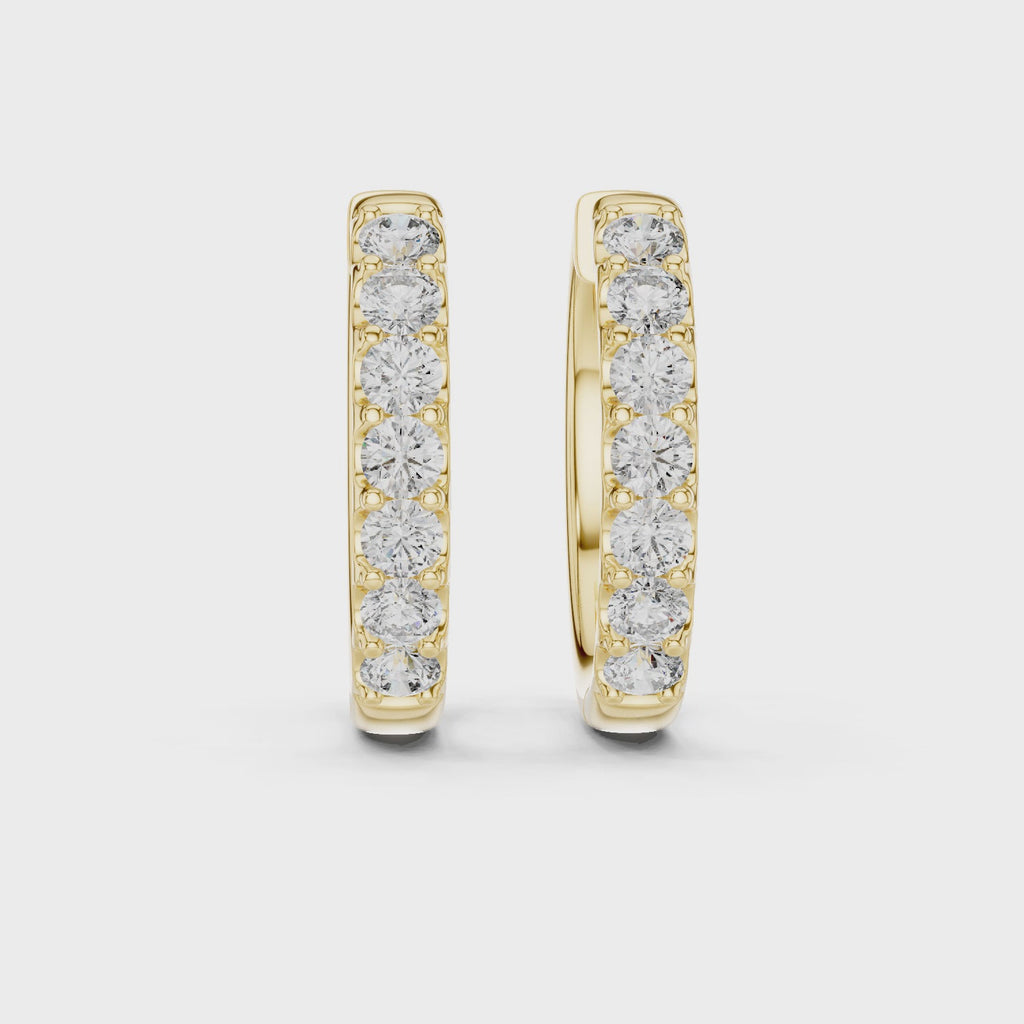 360 rotating video of Roy Diamond yellow gold diamond huggie hoop earrings with round diamonds and polished shine